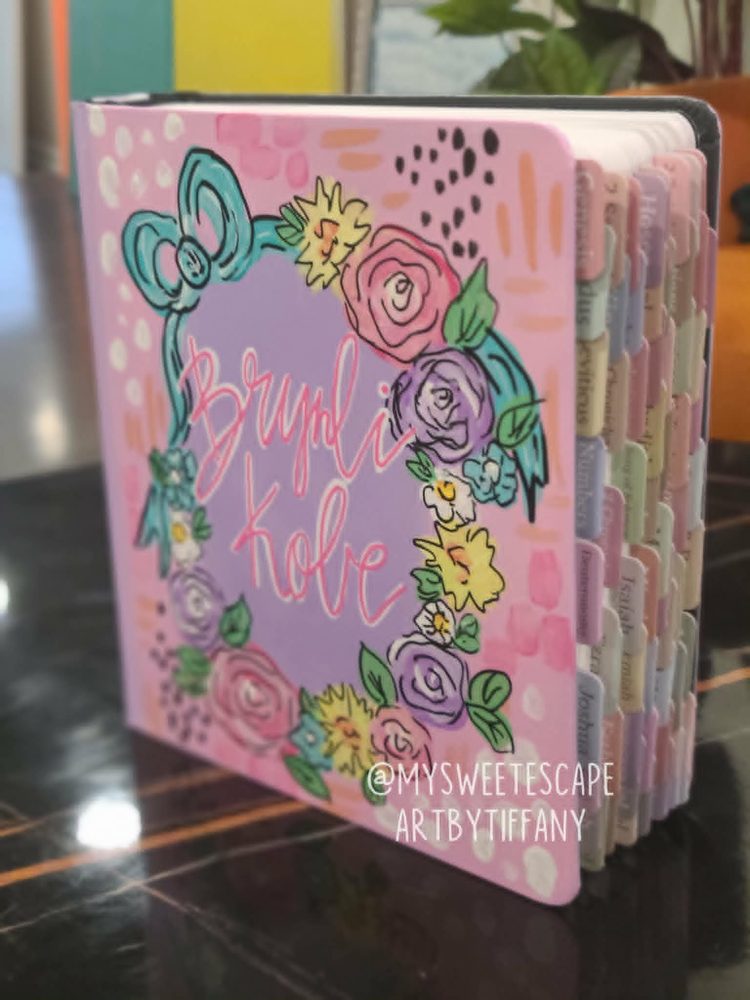 Pink hand-painted Bible cover for Brynli Kobe with floral wreath and turquoise bow