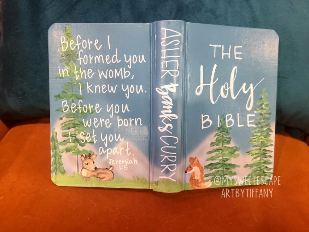 Hand-painted Bible cover for Asher Banks Curry with woodland scene, deer, fox, and pine trees