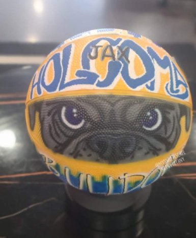 Hand-painted basketball with realistic Holsomback Bulldogs pug mascot, 'Jax' name detail, and blue and yellow graffiti lettering