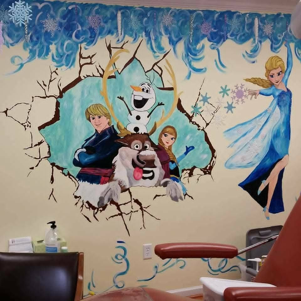 Frozen-themed nail salon mural with a wintery ice scene featuring Anna, Kristoff, Olaf, and Sven bursting through a cracked wall, with Elsa beside them in a flowing blue gown